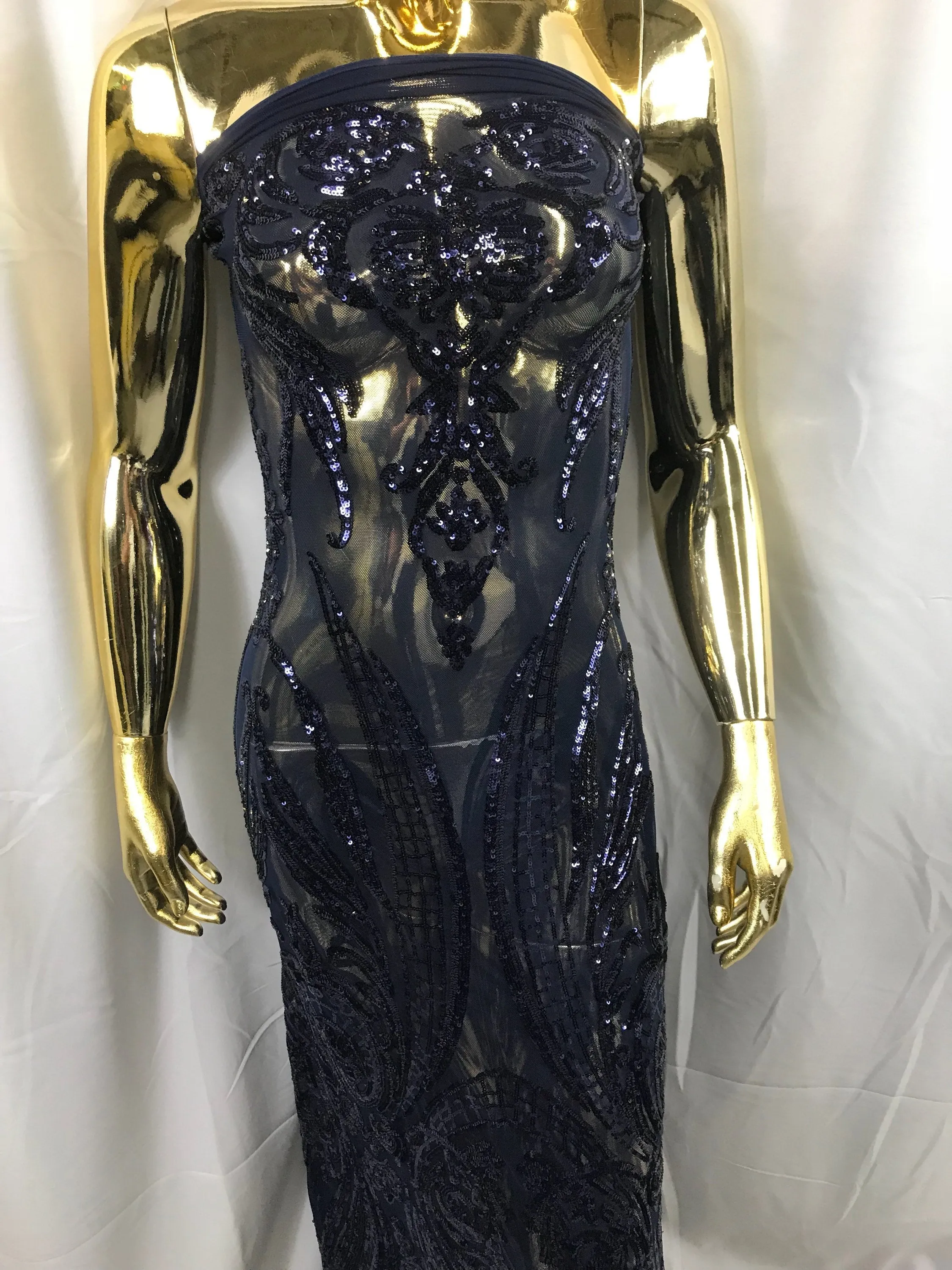Navy blue princess design embroidery with shiny sequins on a 4 way stretch mesh-sold by the yard.