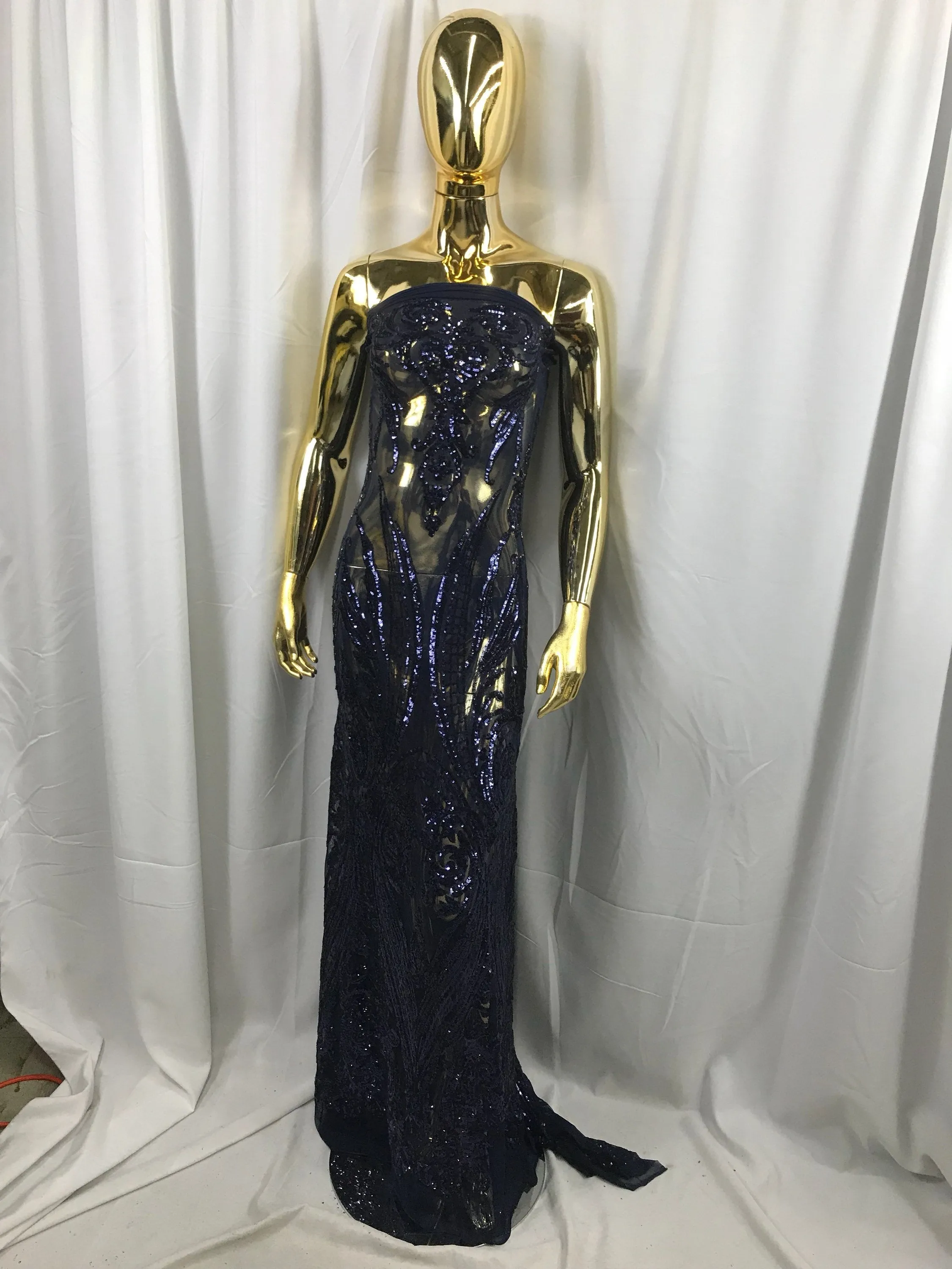 Navy blue princess design embroidery with shiny sequins on a 4 way stretch mesh-sold by the yard.