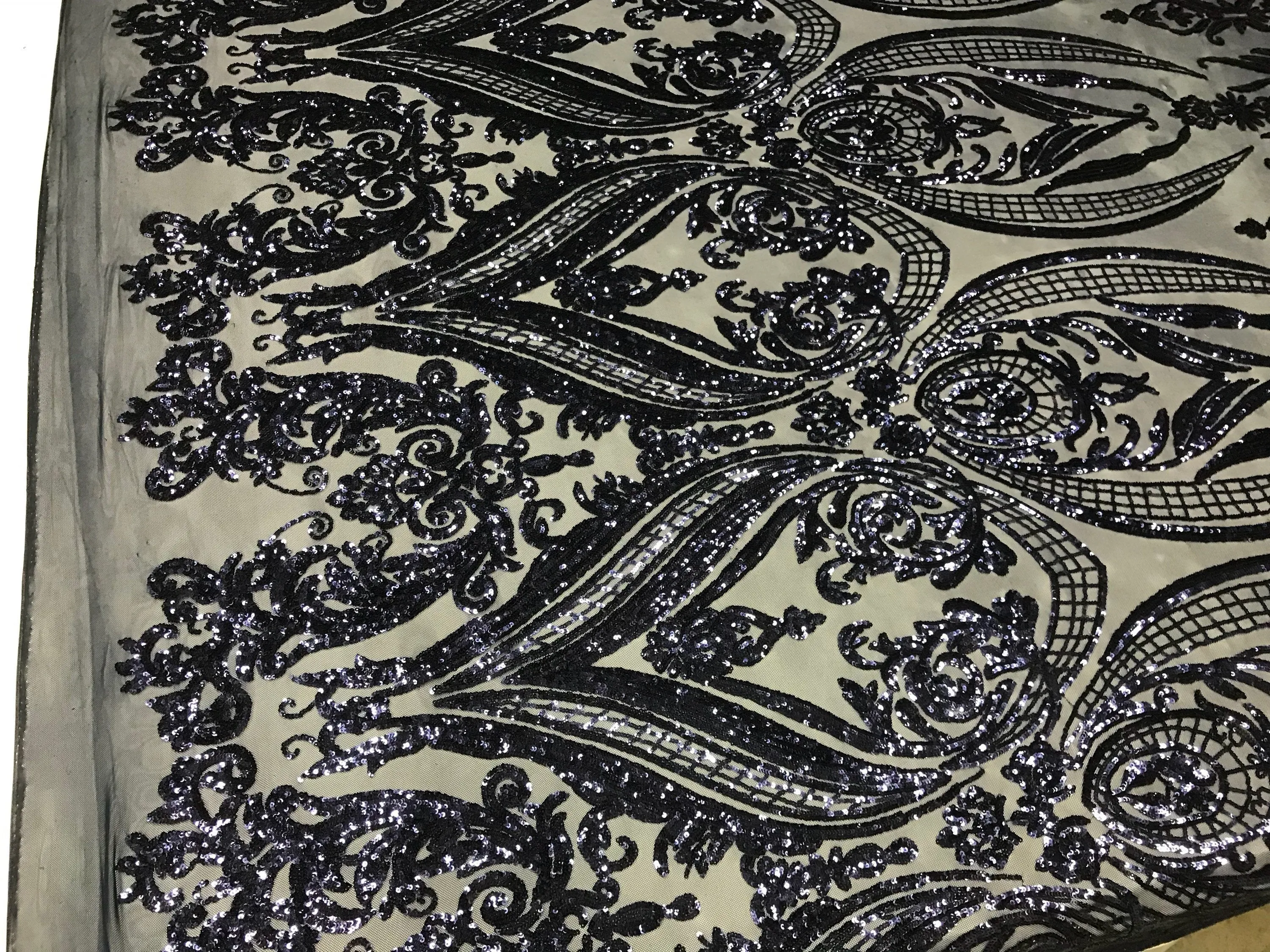 Navy blue princess design embroidery with shiny sequins on a 4 way stretch mesh-sold by the yard.