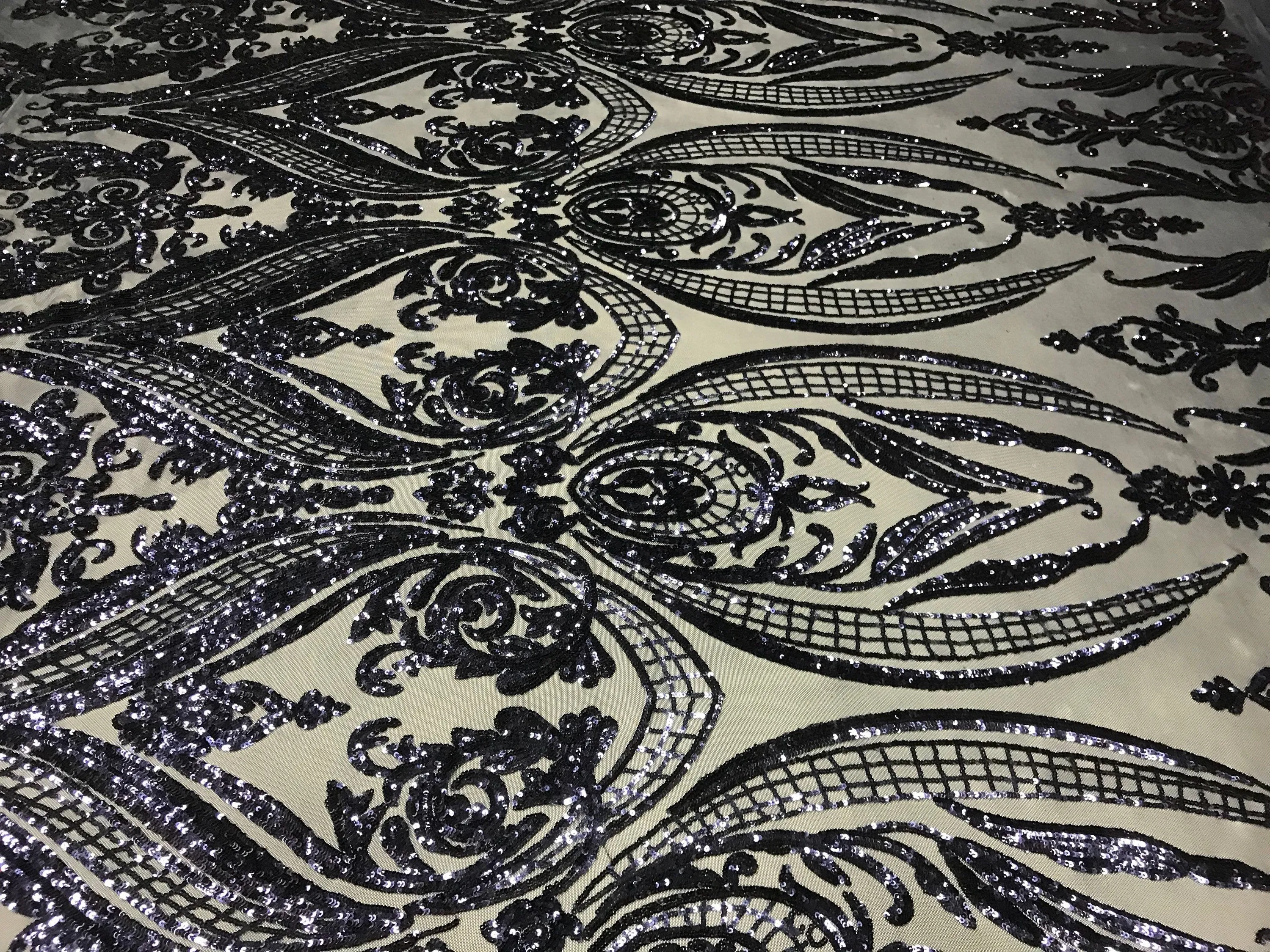 Navy blue princess design embroidery with shiny sequins on a 4 way stretch mesh-sold by the yard.